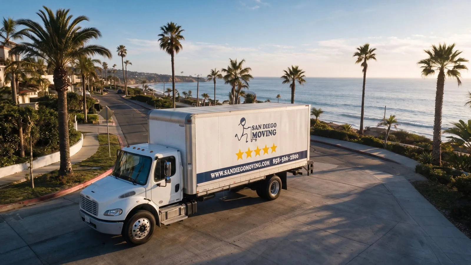San Diego Moving truck on a coastal road above the ocean