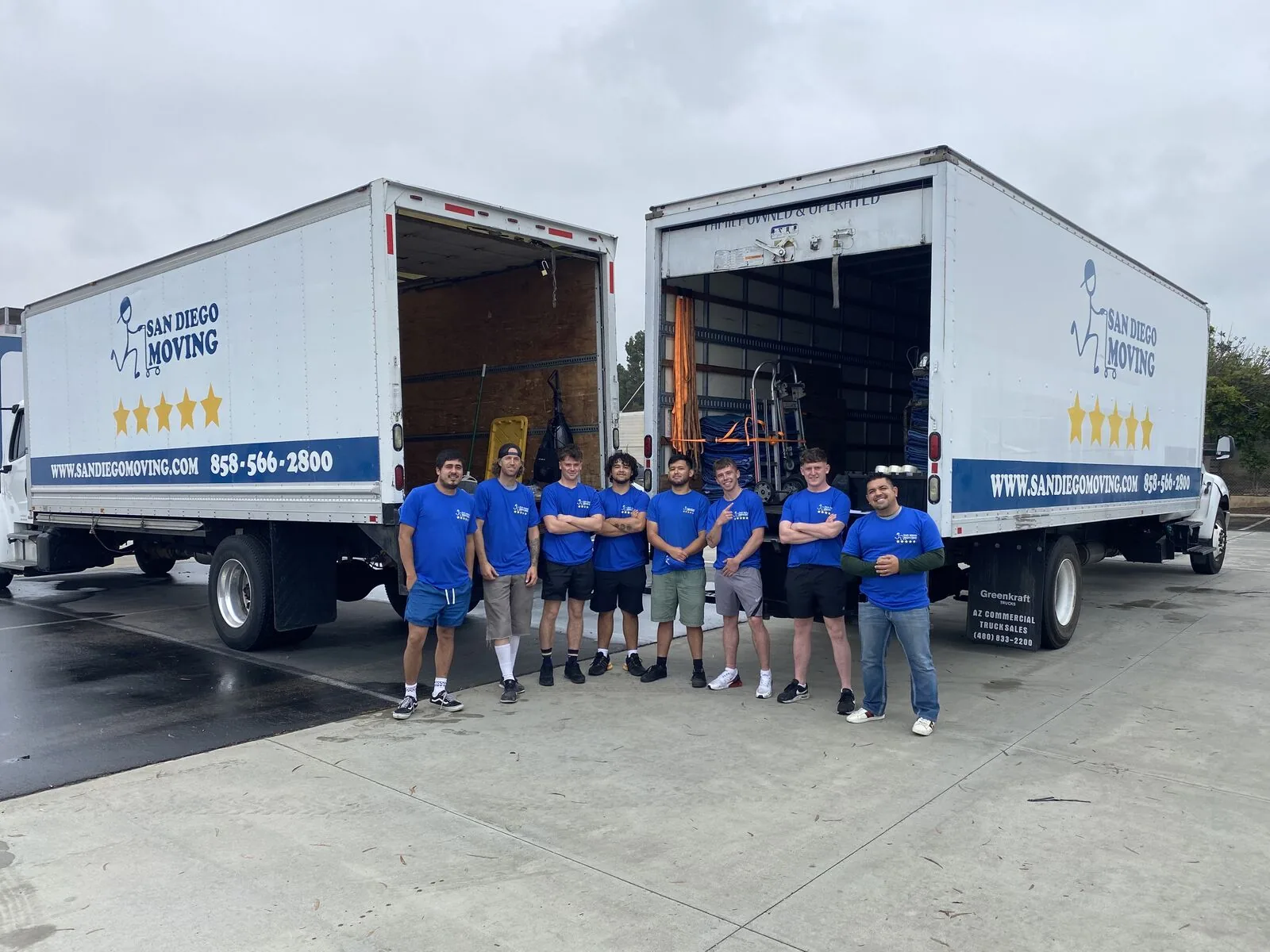 The San Diego Moving crew with two of the company trucks