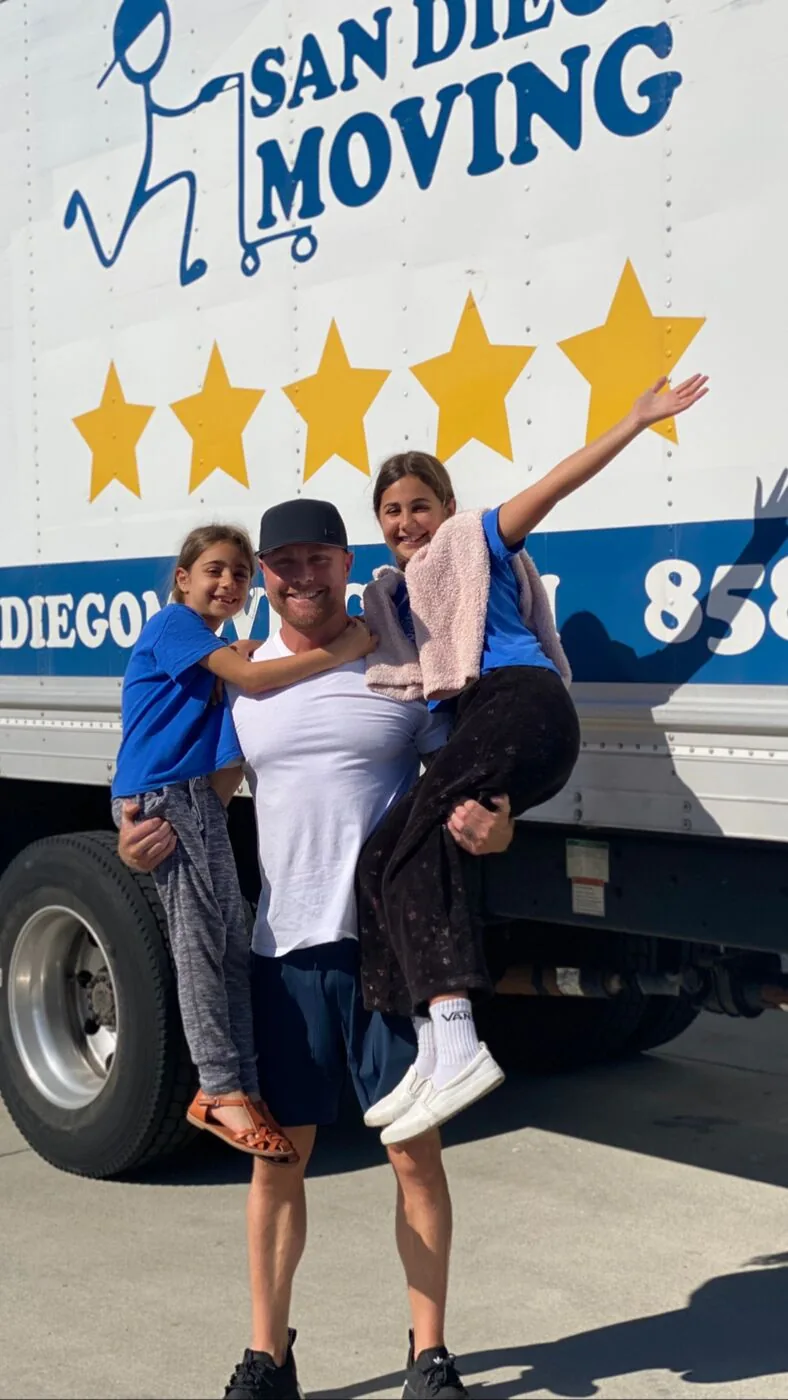 Darren D’hont with his daughters in front of a San Diego Moving truck